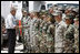 President George W. Bush meets military personnel Monday, Sept. 1, 2008 at the Alamo Regional Command Reception Center at Lackland Air Force Base in San Antonio, Texas, after attending a briefing on the response preparation for Hurricane Gustav.