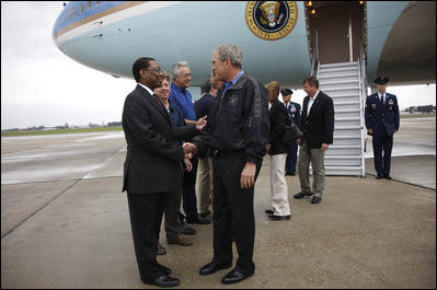President George W. Bush is greeted by Baton Rouge Mayor Kip Holden after arriving in Louisiana Wednesday, Sept. 3, 2008. The President met with federal, state and local officials at the Louisiana State Emergency Operations Center for a briefing in the aftermath of Hurricane Gustav.