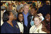 President George W. Bush stands with workers inside the Louisiana State Emergency Operations Center Wednesday, Sept. 3, 2008, in Baton Rouge. Speaking to all those who came to the aide in the wake of Hurricane Gustav, the President said, "I want to thank all the volunteers and the faith-based community that always rises up in a challenge like this. They listen to that universal call to love a neighbor... And that's happening here in Louisiana again."