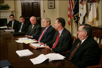 President George W. Bush is joined by Secretary of Energy Samuel Bodman, (third from left), FEMA Administrator David Paulison, (second from right), and Deputy Secretary for the Department of Homeland Security Paul Schneider, right, as he speaks to the press from the Roosevelt Room following a briefing on the latest developments concerning Hurricane Ike, Sunday, Sept. 14, 2008.