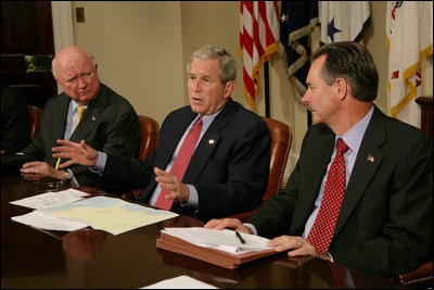 President George W. Bush is joined by Secretary of Energy Samuel Bodman, left, and FEMA Administrator David Paulison, right, as he speaks to the press from the Roosevelt Room following a briefing on the latest developments concerning Hurricane Ike, Sunday, Sept. 14, 2008.