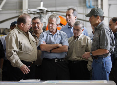 President George W. Bush meets with locals officials at the U.S. Coast Guard facility at Ellington Field in Houston Tuesday, Sept. 16, 2008 before taking an aerial tour of Texas areas damaged in last weekend's hurricane. Said the President afterward, "My first observation is that the state government and local folks are working very closely and working hard and have put a good response together. The evacuation plan was excellent in its planning and in execution. The rescue plan was very bold, and we owe a debt of gratitude to those who were on the front line pulling people out of harm's way, like the Coast Guard people behind us here."