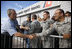 President George W. Bush shakes hands of military personnel outside the emergency operations center at the U.S. Coast Guard Hangar at Ellington Field in Houston Tuesday, Sept. 16, 2008, during his visit to Texas to see firsthand the destruction left in the wake of last weekend's Hurricane Ike.