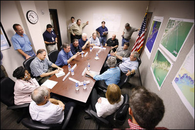 President George W. Bush speaks with state and local officials during a briefing Tuesday, Sept. 16, 2008, at the Galveston emergency operations center. The President spent the day in Texas visiting the areas hardest hit by Hurricane Ike, which made landfall September 13 near Galveston as a Category 2 storm with sustained winds of 110 miles per hour.