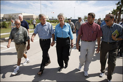 President George W. Bush walks hand-in-hand with Galveston Mayor Lyda Ann Thomas Tuesday, Sept. 16, 2008, during a visit to the Texas area hard hit by last weekend's Hurricane Ike. Walking with them from left are: Charlie Kelly, Emergency Manager Coordinator for the City of Galveston; President Bush, Mayor Thomas, Steve LeBlanc, Galveston City Manager and Texas Congressman Nick Lampson.