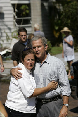 President Bush consoles a resident during a visit to Punta Gorda, Fla., Aug. 15, 2004. As the region was repeatedly struck by storms, the President visited many times and listened to the needs of the local communities. “I've asked Congress to provide $12.2 billion to respond to Hurricanes Charley, Frances, Ivan and Jeanne. My request provides resources to repair bridges and highways and hospitals. It includes funding for the Small Business Administration to make loans to home owners and small businesses,” said the President during a Sept 29th visit to the region.