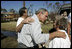 President Bush spends time with local residents during a walking tour of hurricane damage in Pensacola, Fla., Sept. 19, 2004. Talking with first responders about available aid, the President said, “But the governors and I fully understand there are people inland who have been affected; there are people in rural Alabama, small-town Alabama whose lives have been turned upside down by this storm, as well; people in rural Florida who have been affected by this storm,” said the President in Orange Beach, Ala., Sept. 19, 2004.