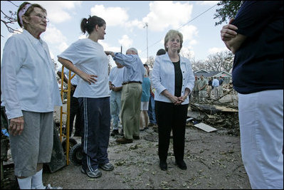 Mrs. Cheney talks with surviving residents of one Gulfport, Mississippi neighborhood during a walking tour of the Hurricane Katrina damaged areas Thursday, September 8, 2005.