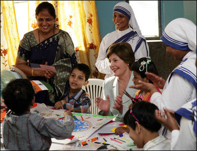 Mrs. Laura Bush meets with teachers and children, Thursday, March 2, 2006, during her visit to Mother Teresa's Jeevan Jyoti (Light of Life) Home for Disabled Children in New Delhi, India.