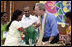 President George W. Bush is presented with a flowered neck garland upon his arrival Friday, March 3, 2006, to Acharya N.G. Ranga Agriculture University in Hyderabad, India.