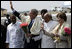 President George W. Bush and Laura Bush wave as they prepare to depart Hyderabad Airport Landing Zone for a return flight to New Delhi.