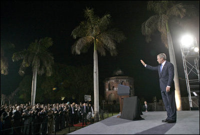 President George W. Bush waves as he leaves the stage Friday, March 3, 2006, after delivering remarks at Purana Qila in New Delhi before departing India for Pakistan.