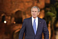 President George W. Bush acknowledges the audience as he arrives for remarks Friday, March 3, 2006, at the Purana Qila in New Delhi.