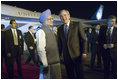 President George W. Bush is welcomed to India by Indian Prime Minister Manmohan Singh upon Air Force One's arrival Wednesday, March 1, 2006, at Indira Gandhi International Airport. The President and First Lady are scheduled to spend three days in the country before flying to Pakistan.