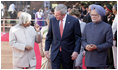 President George W. Bush listens to India's President A.P.J. Abdul Kalam as they walk the red carpet with Prime Minister Manmohan Singh during the arrival ceremony in New Delhi Thursday, March 2, 2006, welcoming the President and Mrs. Bush to India.