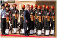 President George W. Bush participates in the troop review Thursday, March 2, 2006, during the arrival ceremony at Rashtrapati Bhavan in New Delhi.