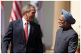 President George W. Bush smiles as he stands with India's Prime Minister Manmohan Singh during a press availability in New Delhi Thursday, March 2, 2006. The President told those in attendance that India and America "have built a strategic partnership based on common values," and thanked the Indian people and the Indian government "for supporting the new democracy in the neighborhood."