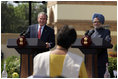 President George W. Bush smiles as he responds to a question Thursday, March 2, 2006, during a press availability with India's Prime Minister Manmohan Singh in the Mughal Garden at the Hyderabad House in New Delhi.