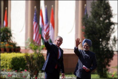 President George W. Bush and Prime Minister Manmohan Singh of India wave as they leave Mughal Garden at the Hyderabad House after a press availability in New Delhi Thursday, March 2, 2006.