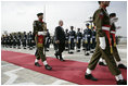 President George W. Bush is escorted by an honor guard as he reviews Pakistan troops at his official welcome to Aiwan-e-Sadr in Islamabad, Pakistan, Saturday, March 4, 2006.