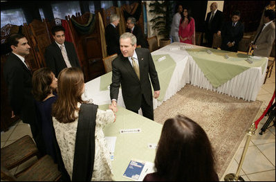President George W. Bush greets participants, Saturday, March 4, 2006 at the Roundtable with Pakistani Society Representatives at the U.S. Embassy in Islamabad, Pakistan.