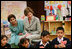 Mrs. Laura Bush listens to a student answer a question as she attends a class lesson in the Children's Resources International clasroom at the U.S. Embassy , Saturday, March 4, 2006 in Islamabad, Pakistan.
