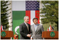 President George W. Bush and Pakistan President Pervez Musharraf stand together following their joint news conference at Aiwan-e-Sadr in Islamabad, Pakistan, Saturday, March 4, 2006.