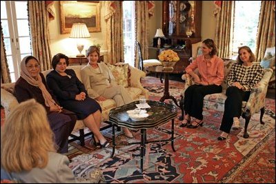 Laura Bush discusses Women's Issues with, from left; Dr. Habiba Sarabi, Afghanistan's Minister of Women's Affairs; Pascale Isho Warda, Iraq's new Minister of Displacement and Migration; Laura Bush, Dalia Qahraman Kaikhasraw, Iraqi Fulbright Scholar; Dr. Paula Dobriansky, America's Under Secretary of State for Global Affairs in Sea Island, Ga., June 9, 2004. 
