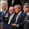 Listing recent achievements reached in Iraq, President George W. Bush holds a press conference in the Rose Garden, Wednesday, July 23, 2003. Standing with the President are Chairman of the Joint Chiefs of Staff General Richard Myers, Secretary of Defense Donald Rumsfeld and Presidential Envoy to Iraq Ambassador Paul Bremer. White House photo by Paul Morse.