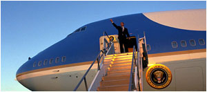 President George W. Bush gives a thumbs-up from Air Force One in Waco, Texas, Sept. 26. "We are engaged in a deliberate and civil and thorough discussion. We are moving toward a strong resolution," said the President during a bi-partisan press conference earlier in the day. "The Iraqi dictator must be disarmed. These requirements will be met, or they will be enforced."