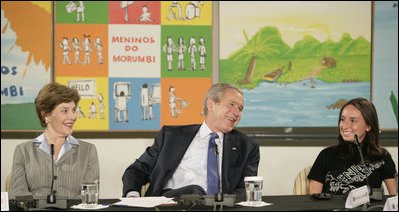 President George W. Bush and Laura Bush smile as they participate in a community roundtable Friday, March 9, 2007, at Meninos do Morumbi in Sao Paulo. The Brazilian organization teaches musical skills to the city’s youth as an alternative to drugs and crime. White House photo by Eric Draper