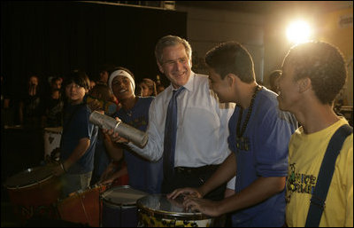 President George W. Bush joins youthful musicians during a visit Friday, March 9, 2007, to Meninos do Morumbi in Sao Paulo. White House photo by Eric Draper