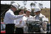 President George W. Bush and Brazil’s President Luiz Inacio Lula da Silva, right, participate in a demonstration of biofuel technology Friday, March 9, 2007, at the Petrobras Transporte S.A. Facility in Sao Paulo. White House photo by Paul Morse