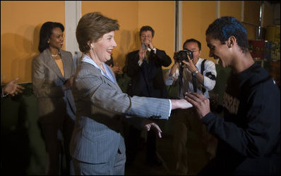 Mrs. Laura Bush follows a student’s lead during a quick dance Friday, March 9, 2007, at Sao Paulo’s Meninos do Morumbi. White House photo by Paul Morse