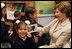 Mrs. Laura Bush greets students at the Rafael Pombo Foundation, a reading center named for the 19th Century poet, during her visit Sunday, March 11, 2007 in Bogota, Colombia. White House photo by Shealah Craighead
