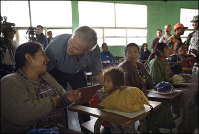 President George W. Bush visits with a villager at the Medical Readiness and Training Exercise Site at the Carlos Emilio Leonard School during a visit Monday, March 12, 2007, in Santa Cruz Balanya, Guatemala. White House photo by Eric Draper