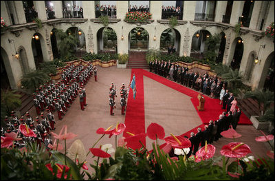 President George W. Bush and Laura Bush stand with President Oscar Berger and Wendy Widmann de Berger during arrival ceremonies at the Palacio de la Cultura in Guatemala City. White House photo by Paul Morse