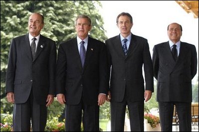 President George W. Bush poses with G8 leaders during the G8 Summit in Evian, France, Monday, June 2, 2003. From left, President Jacques Chirac of France, President Bush, Prime Minister Tony Blair of Great Britain and Prime Minister Silvio Berlusconi of Italy. White House photo by Eric Draper