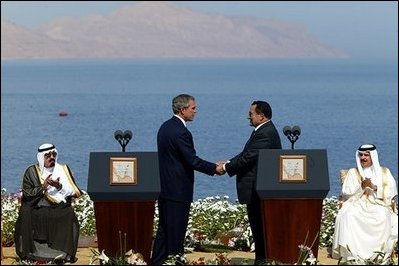 President George W. Bush and President Hosni Mubarak of Egypt after delivering statements on the progress of the Red Sea Summit in Sharm El Sheikh, Egypt June 3, 2003. On the far left sits Prince Abdullah Bin Abd Al Aziz of Saudi Arabia and on the far right sits King Hamad Bin Issa Al Khalifa of Bahrain. White House photo by Paul Morse