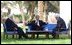 President George W. Bush, center, discusses the Middle East peace process with Prime Minister Ariel Sharon of Israel, left, and Palestinian Prime Minister Mahmoud Abbas in Aqaba, Jordan, Wednesday, June 4, 2003. White House photo by Paul Morse