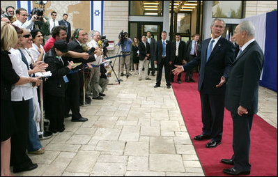 President George W. Bush and President Shimon Peres of Israel talk to members media following their meeting Wednesday, May 14, 2008, at President Peres' Jerusalem residence.