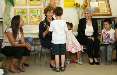 Mrs. Laura Bush shares a moment with a kindergarten student Wednesday, May 14, 2008, at the Hand in Hand School for Jewish-Arab Education in Jerusalem. Mrs. Bush took the opportunity to visit the school with Mrs. Aliza Olmert, right, spouse of Israeli Prime Minister Ehud Olmert.