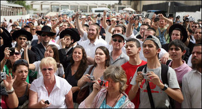 A crowd gathers near the Western Wall in Jerusalem Wednesday, May 14, 2008, in hopes of catching a glimpse of Mrs. Laura Bush as she visits the site during a stop by she and President George W. Bush in Jerusalem.