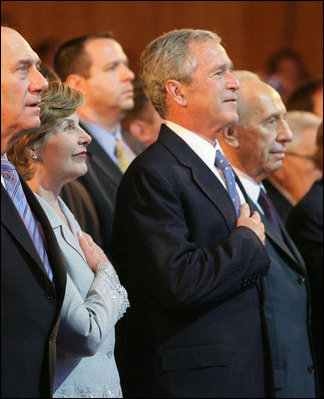 President George W. Bush and Laura Bush are seen with Israeli leaders Prime Minister Ehud Olmert, left, and Israeli President Shimon Peres during the playing of the National Anthem Wednesday, May 14, 2008 in Jerusalem, during a celebration of Israel's 60th anniversary as a nation at the Israeli Presidential Conference 2008 at the Jerusalem International Convention Center.