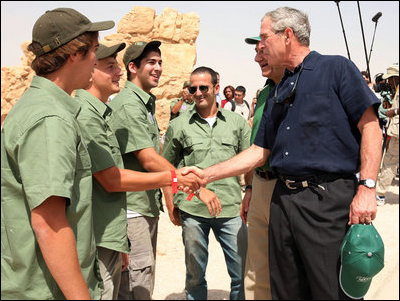 President George W. Bush shakes hands with American students from Connecticut, Massachusetts and California who are volunteering at Masada National Park in Masada, Israel. The President met the young men as he toured the historic site with Prime Minister Ehud Olmert, Mrs. Laura Bush and Mrs. Aliza Olmert.