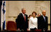 President George W. Bush stands with Dalia Itzik, Speaker of the Knesset, and Israel's President Shimon Peres on the floor of the Knesset Thursday, May 15, 2008, in Jerusalem. During his remarks to the members of the Israel parliament, President Bush said, "We gather to mark a momentous occasion. Sixty years ago in Tel Aviv, David Ben-Gurion proclaimed Israel's independence, founded on the "natural right of the Jewish people to be masters of their own fate." What followed was more than the establishment of a new country. It was the redemption of an ancient promise given to Abraham and Moses and David -- a homeland for the chosen people Eretz Yisrael."