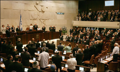 President George W. Bush receives a standing ovation by members of the Knesset Thursday, May 15, 2008, in Jerusalem. Acknowledging the 60th anniversary of Israel's independence, the President told the Israeli parliament, "Earlier today, I visited Masada, an inspiring monument to courage and sacrifice. At this historic site, Israeli soldiers swear an oath: "Masada shall never fall again." Citizens of Israel: Masada shall never fall again, and America will be at your side."
