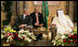 President George W. Bush smiles as he and King Abdullah bin Abdulaziz exchange greetings during a arrival ceremony Friday, May 16, 2008, at the Riyadh-King Khaled International Airport in Riyadh. At center is interpreter Gamal Helal.