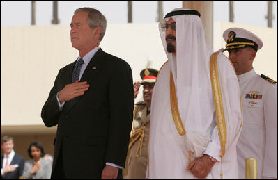 President George W. Bush and King Abdullah bin Adbulaziz pause for the playing of their respective national anthems Friday, May 16, 2008, during arrival ceremonies for the President and Mrs. Laura Bush at Riyadh-King Khaled International Airport in Riyadh.