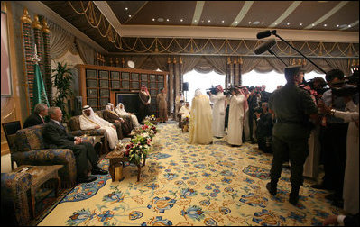 President George W. Bush and King Abdullah bin Abdulaziz are the center of attention as they sit for photographs Friday, May 16, 2008, during the arrival ceremony for the President and Mrs. Laura Bush at Riyadh-King Khaled International Airport in Riyadh.